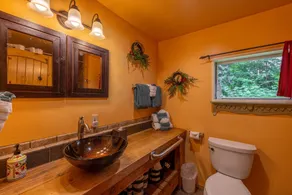 This historic cabin is just a few miles from Mt Rainier National Park. Pet friendly. Fish pond, pastures, old cedars, 11-acres. Private hot tub surrounded by grove of old cedars. - Image 2