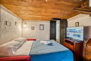 GuestHost - Comfortable apartment located in a historic Abbey from the year 1000, restored in 1980.La Badia is a small Benedictine Abbey immersed in a park of centuries-old olive trees.Located on the ground floor, there is a mezzanine for the sleeping ar - Image 5