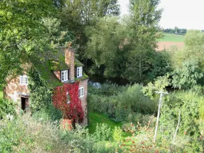 Situated by the banks of a river with private fishing just yards away. - Image 5