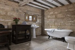 Exposed timbers, a feature stone fireplace, flagstone and oak floors – The Chapel has a wealth of pe - Image 4