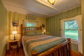 This historic cabin is just a few miles from Mt Rainier National Park. Pet friendly. Fish pond, pastures, old cedars, 11-acres. Private hot tub surrounded by grove of old cedars. - Image 4