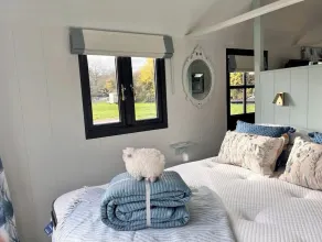 Boutique Shepherds Hut set in a wildflower meadow on a farm with Highland Cows - Image 4