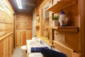 Secluded 1-bedroom lakefront cabin in Lakeside, OR. Ideal for writers or couples seeking solitude. Features a King bed, wood stove, kayak for 2, and stargazing from your private dock. - Image 3