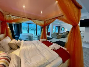 Room at lake Colibita with an incredible view over the lake with Jacuzzi. - Image 3