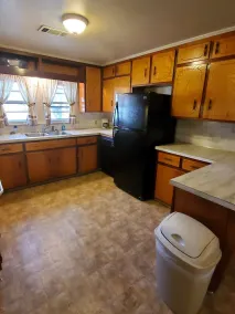 House with a full kitchen big backyard with trees - Image 3