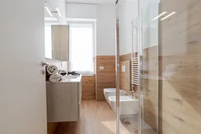 Travel with your family and friends and explore lakes and mountains near Como!This spacious apartment, with two bedrooms, two bathrooms, open space kitchen with island, large living room, small terrace, is located on the road that connects the two main c - Image 3