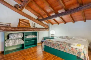 GuestHost - This apartment is located on the top floor of a country villaCharacterized by large spaces including an inviting very bright living room thanks to large windows, a kitchen and a large bedroom accessible via a spiral staircaseAmong the common  - Image 5