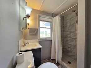 Enjoy a Peaceful environment with neighboring mini pones a fire pit to sit under the stares. roll into the oversized parking lot and enjoy this lovely modern farm home. - Image 2