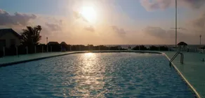 Cabana with a pool and garden view - Image 5