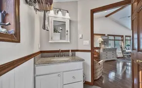 The spacious lakefront house features kayaks and a boat ramp. - Image 4