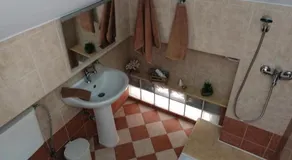 THEOS APARTMENTS - Image 3