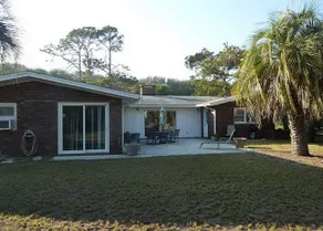 A BEACHFRONT PALM HOUSE by Jekyll Realty - Image 1