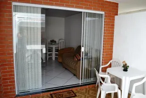 Casa com garagem e churrasqueira a 5 minutos da Praia Grande - Image 5