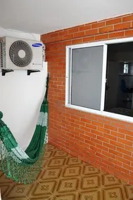 Casa com garagem e churrasqueira a 5 minutos da Praia Grande - Image 2