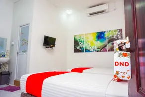 OYO 433 Nelvi Guest House Syariah - Image 3