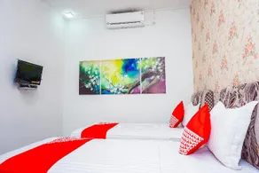 OYO 433 Nelvi Guest House Syariah - Image 2