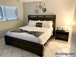 Features king bed smart TV coffee station - Image 3