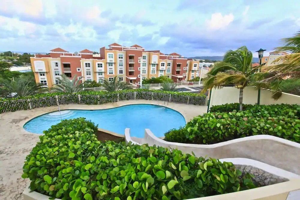 Caribbean Condo with Marina, Pool & Ocean View! 3 minutes from Seven Seas Beach. photo 2