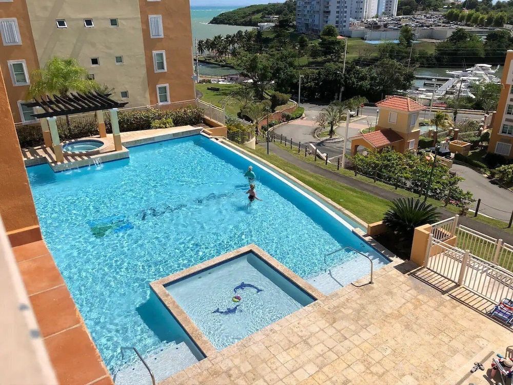 Caribbean Condo with Marina, Pool & Ocean View! 3 minutes from Seven Seas Beach. photo 3